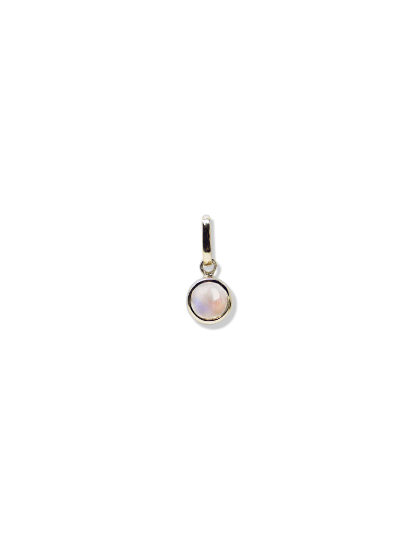 A single bezel charm with a gold frame containing a moonstone gemstone, suspended by a gold loop.